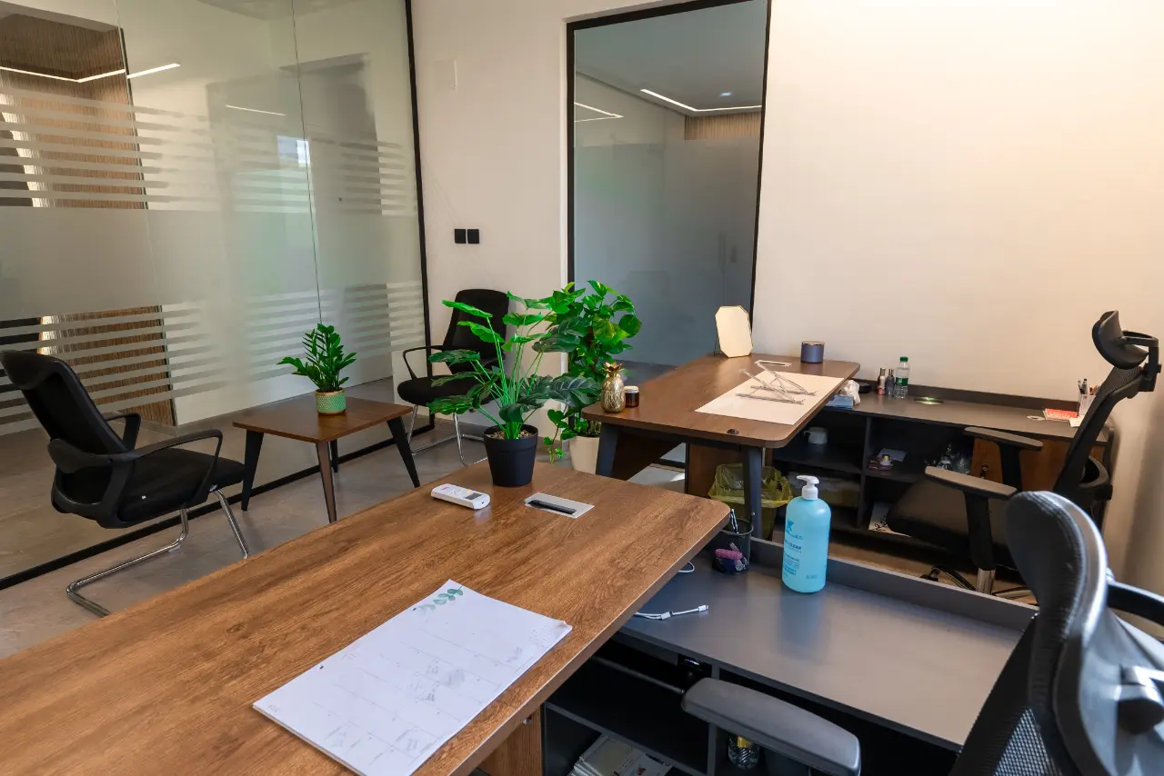 Interior of office with wooden desk and chairs