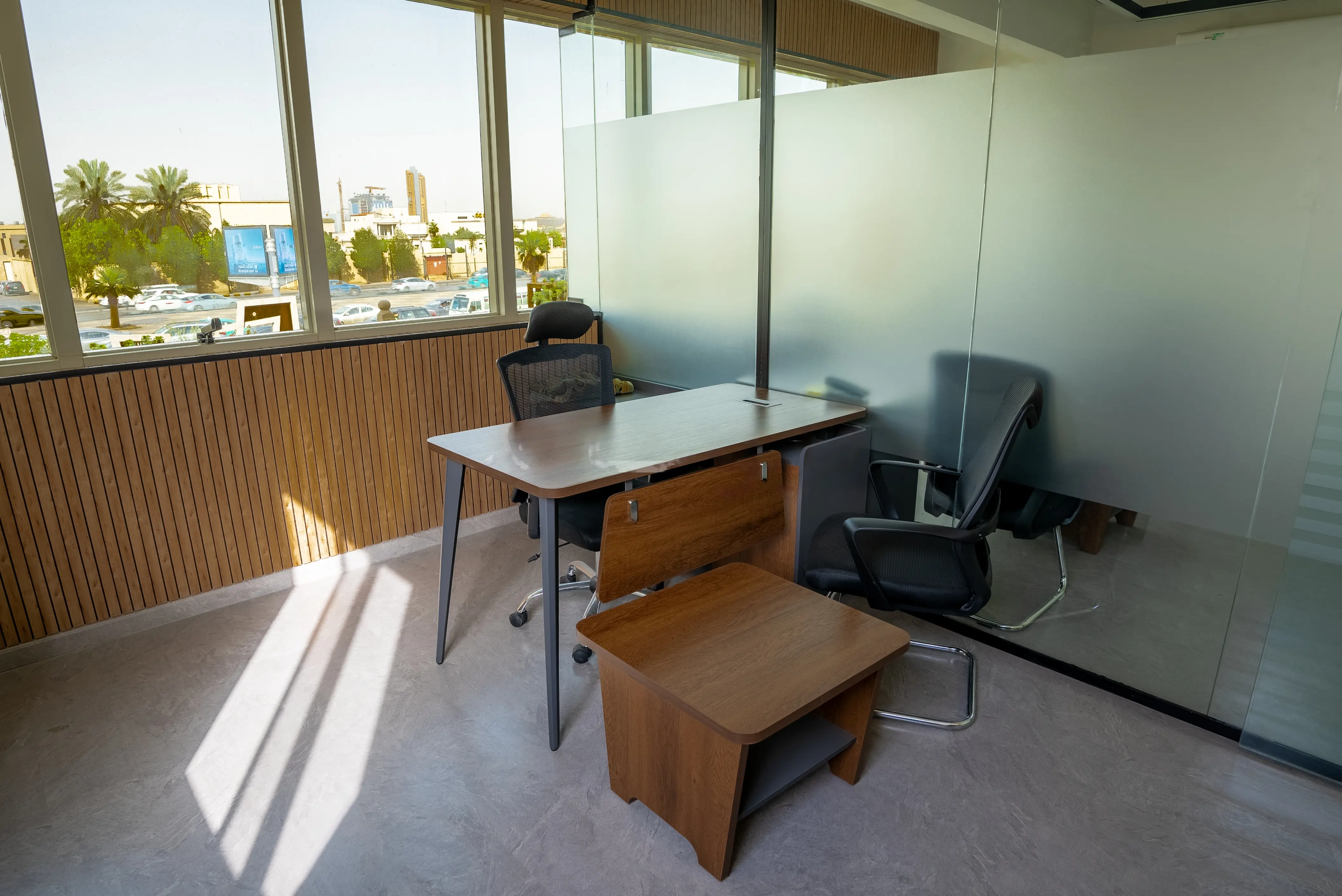  Interior of office with wooden desk and chairs